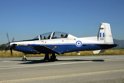 Military airplane on airport taxiway