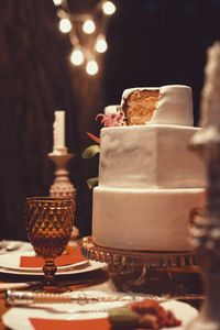 Close-up of three tiered cake on dining table