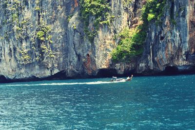 Scenic view of sea against rock formation