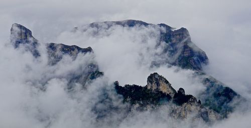 Low angle view of majestic mountain against sky