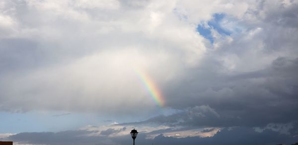 Low angle view of rainbow in sky