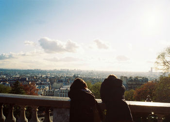 Woman looking at cityscape