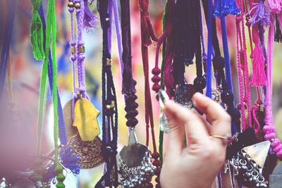 Woman shopping for jewelry at market