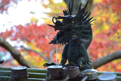 Statue of bird on fountain