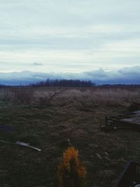 Scenic view of mountains against cloudy sky