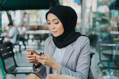 Young woman using mobile phone