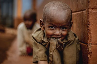 Portrait of boy standing outdoors