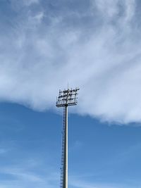 Low angle view of electricity pylon against sky