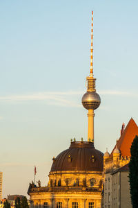 Tower of buildings in city against sky