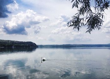 Scenic view of sea against cloudy sky