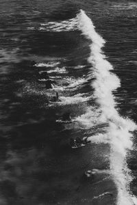 High angle view of sea waves splashing on shore