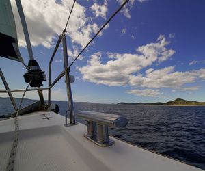 Sailboat on sea against sky