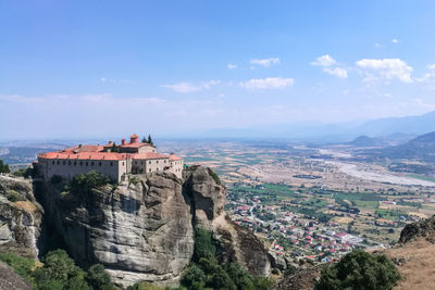 Panoramic view of buildings and mountains against sky