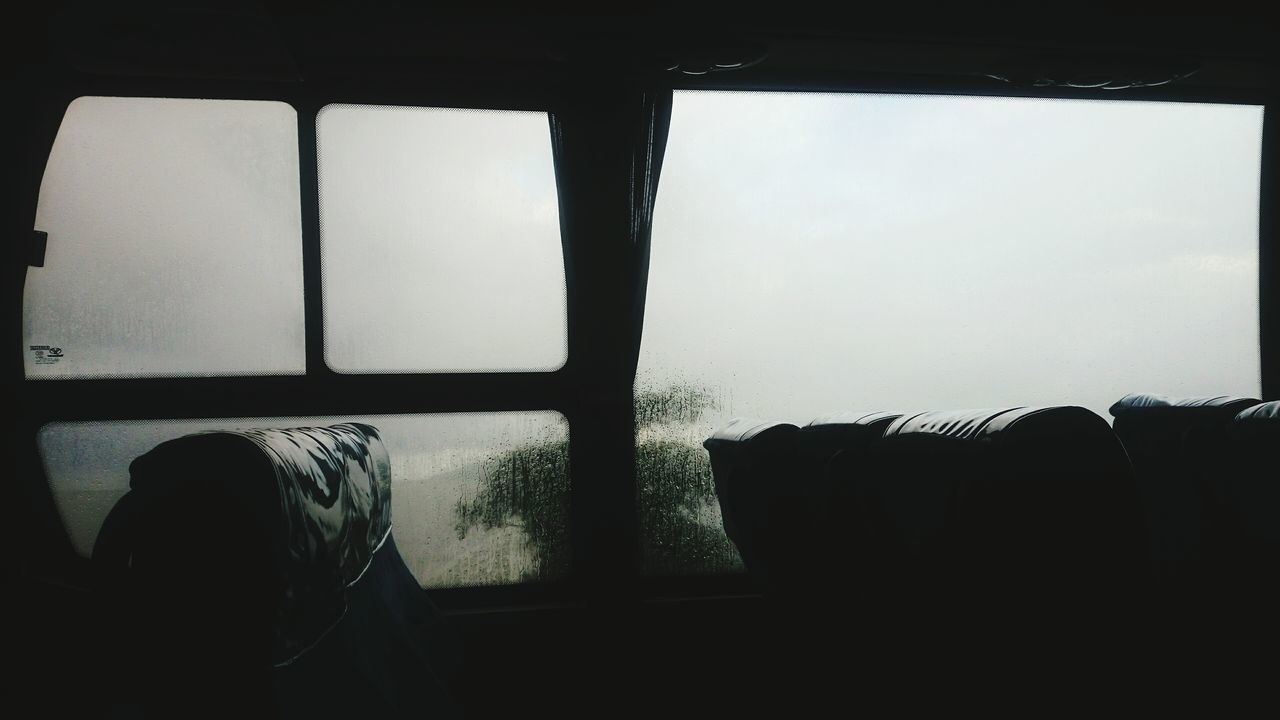 MAN SITTING BY TRAIN WINDOW