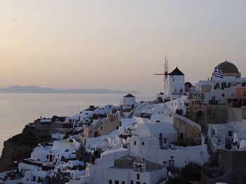 High angle shot of townscape against calm sea