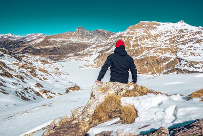 Solo man hiking on alps  walking during winter concepts about travel lifestyle and wanderlust