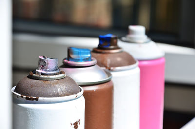 Close-up of spray cans