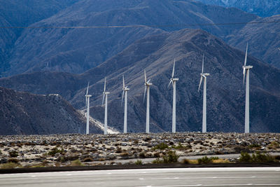 Scenic view of road by mountains