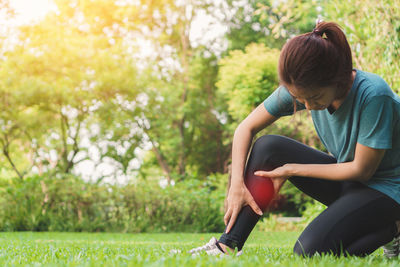 Woman sitting on grass