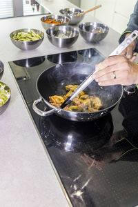 Man preparing food in kitchen at home