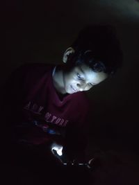 High angle portrait of young man in darkroom