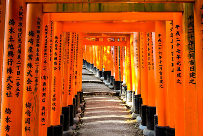 Vermillion gates at the fushimi inari shrine, kyoto, japan