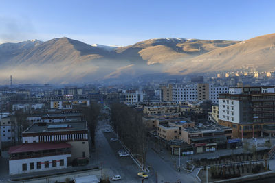 High angle view of town against mountains