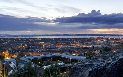 High angle view of illuminated cityscape against sky