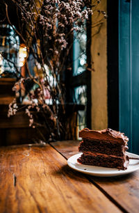 Close-up of cake slice in plates on table