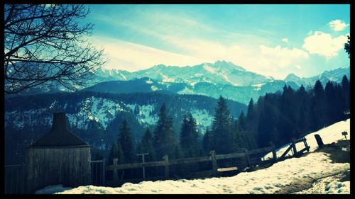 Scenic view of snow covered mountains against sky