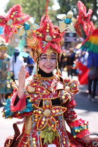 Low angle view of woman dancing in traditional clothing