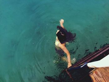 High angle view of woman swimming in lake