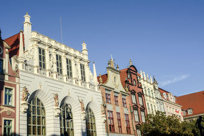 Low angle view of buildings against clear sky