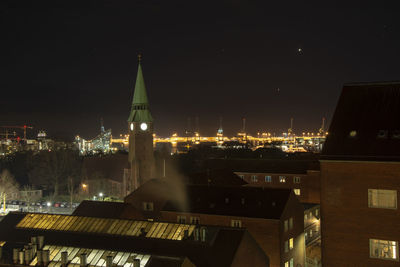 Illuminated buildings in city at night