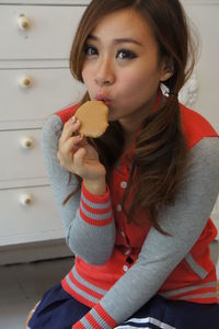 Portrait of cute girl eating food