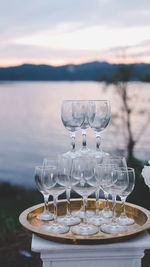 Wine glass at the lake at sunset