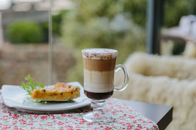 Close-up of coffee served on table