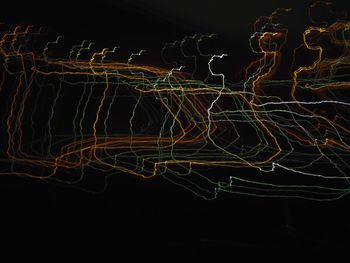 Light trails against sky at night