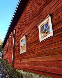 Low angle view of wooden building against sky