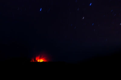 Scenic view of silhouette mountain against sky at night