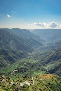 Misty mountain range covered with white mist and amazing blue sky