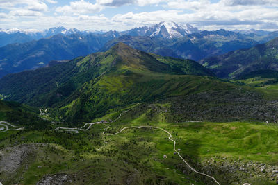 Scenic view of valley and mountains against sky