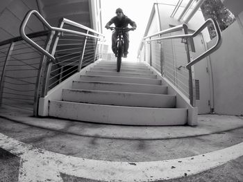Man on bicycle on staircase