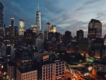 View of skyscrapers lit up at night