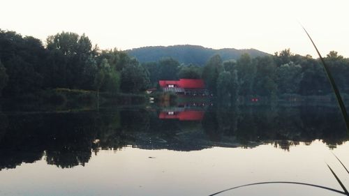Scenic view of calm lake against sky