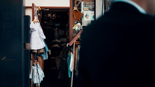 Rear view of woman hanging on clothesline
