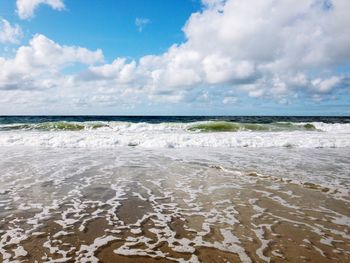 Scenic view of beach against sky