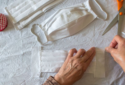 Midsection of man lying on bed