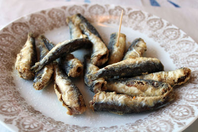 High angle view of fish in plate on table