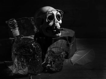 Portrait of man holding eyeglasses on table